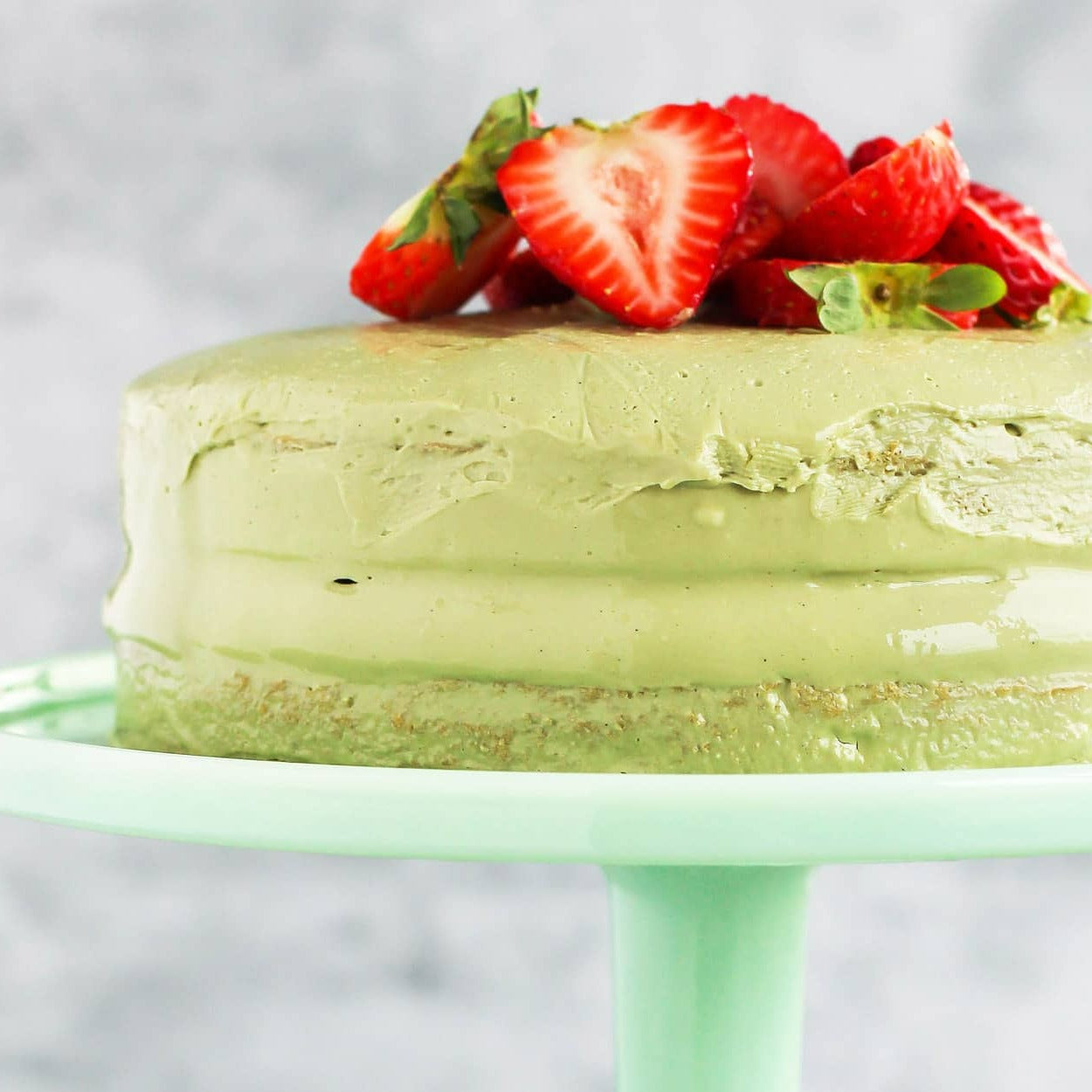 This matcha strawberry cake is made with soft matcha vanilla sponge cake, finished with creamy matcha ganache and decadently topped with fresh strawberries. A great gift for a family or a treat for a special someone to enjoy over and over. Delivered to you across Dubai and the UAE.