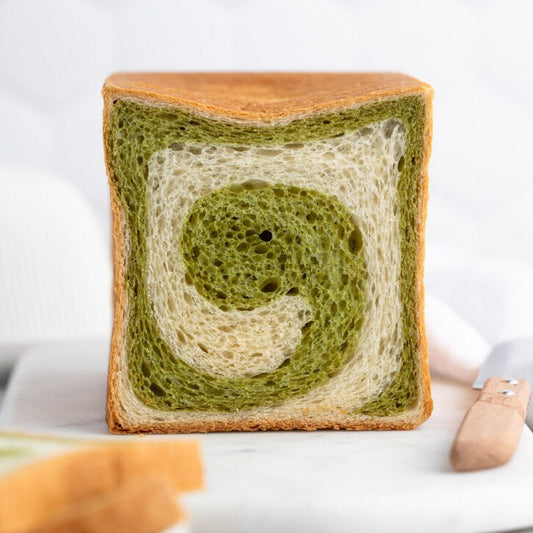 Japanese Matcha Shokupan Bread Loaf, made with organic matcha and organic pea protein. Baked with love in Dubai. A great gift for a family or a treat for a special someone to enjoy over and over. Delivered to you across Dubai and the UAE.